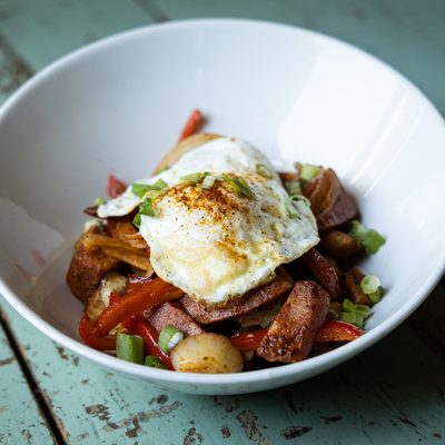 Cajun Breakfast Bowl topped with a fried egg.