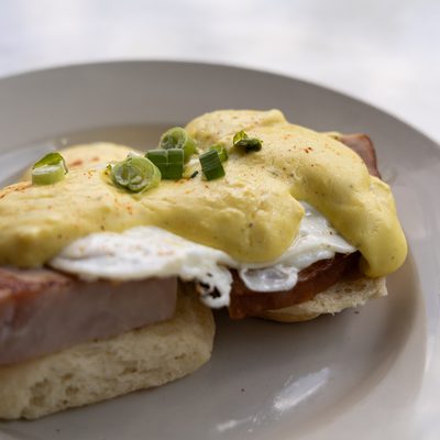 Biscuit Benny with hollandaise and green onions.