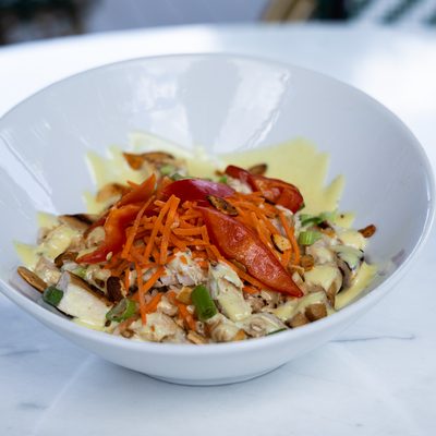 Yummy Yummy Bowl with shredded carrots and peppers.